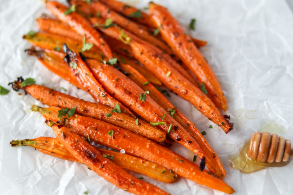  roasted carrots that are drizzled with honey 