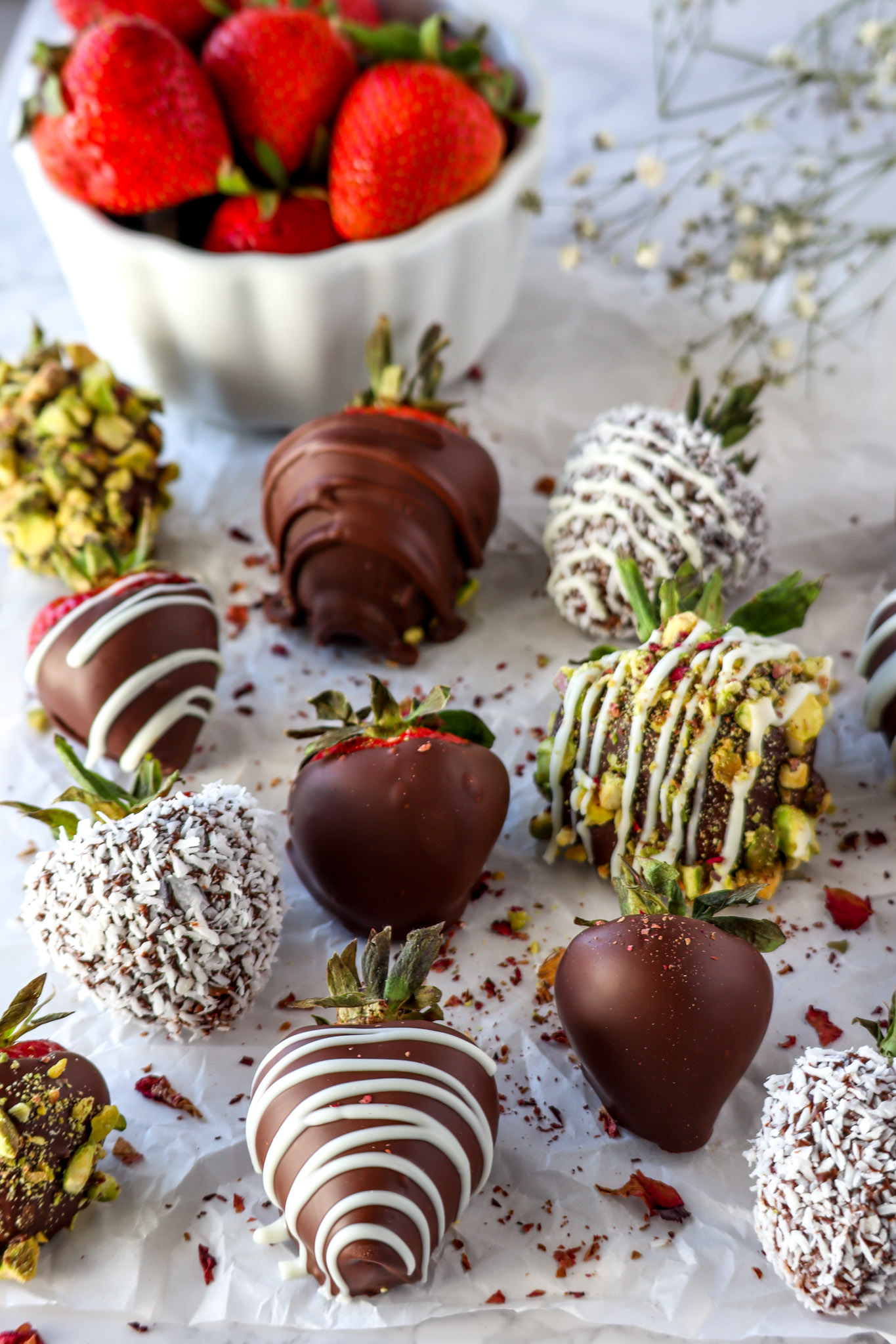 Chocolate covered strawberries on top of crumpled parchment paper
