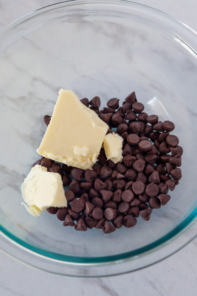 Melting chocolate chips and butter in a microwave safe bowl