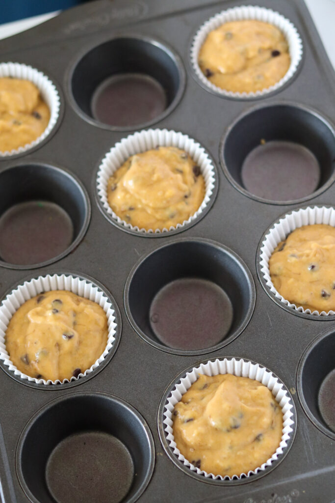 banana pumpkin batter in muffin liners