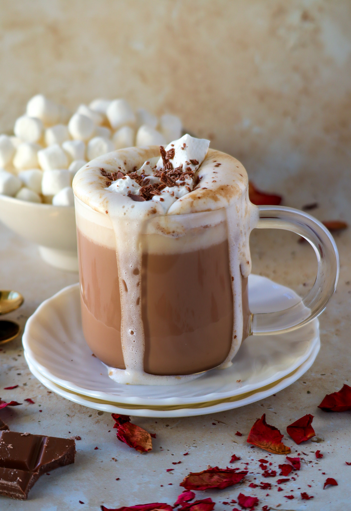 Chai hot chocolate with a dollop of whip cream and chocolate shavings