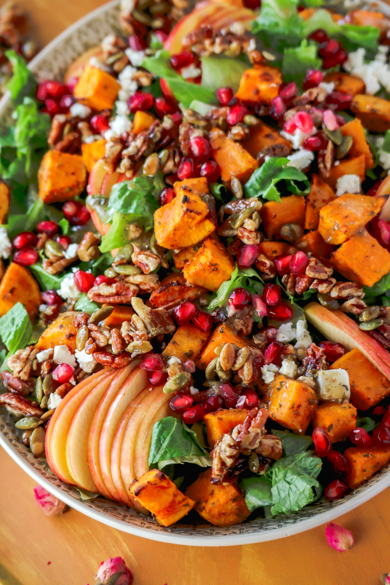 Sweet potato harvest salad with lettuce, feta, pomegranate, apples, pumpkin seeds and pecans