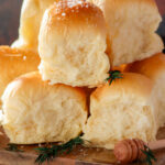Dinner rolls with honey butter and flakey sea salt