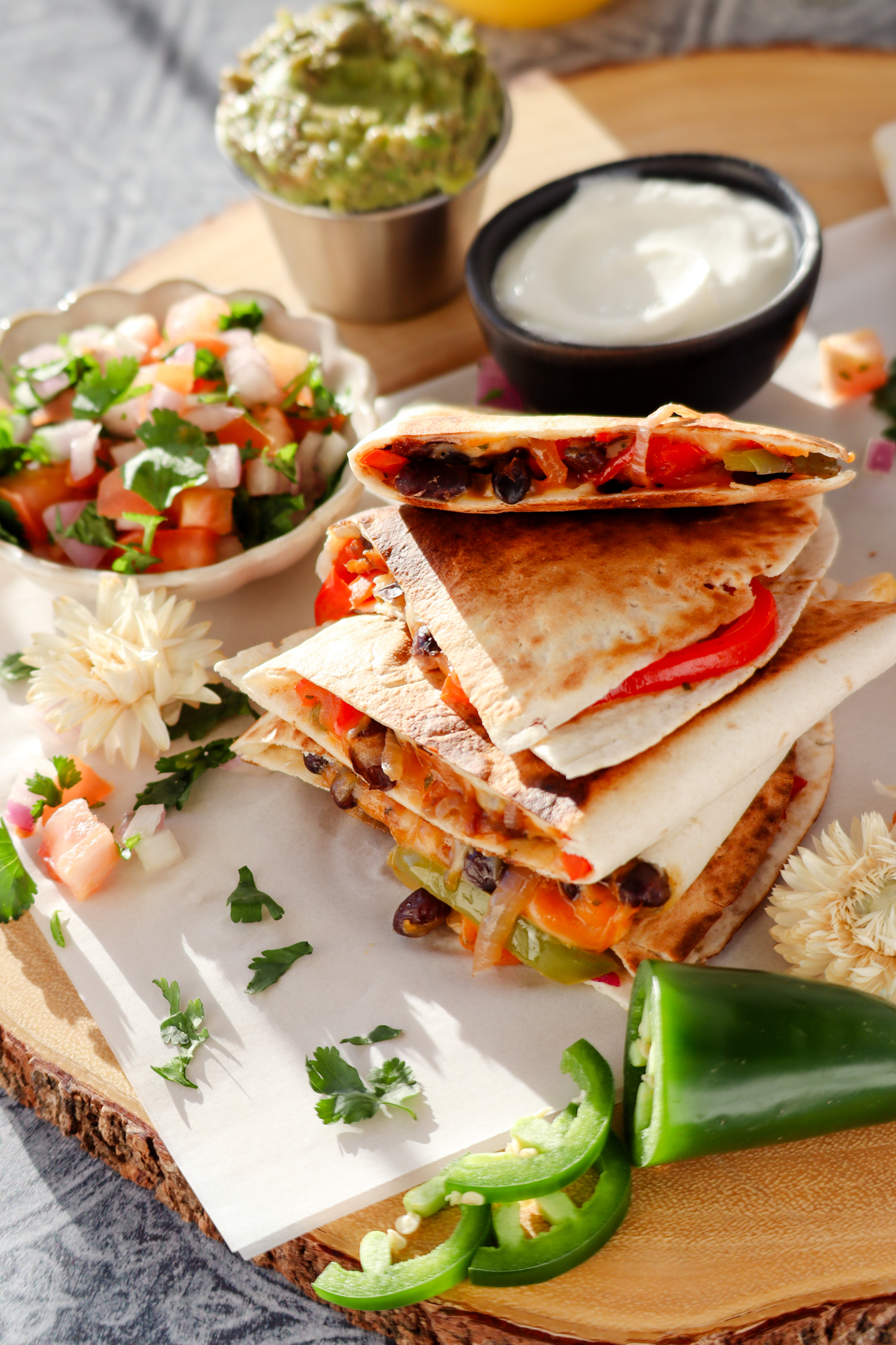 vegetarian black bean quesadillas served with salsa, guacamole and sour cream