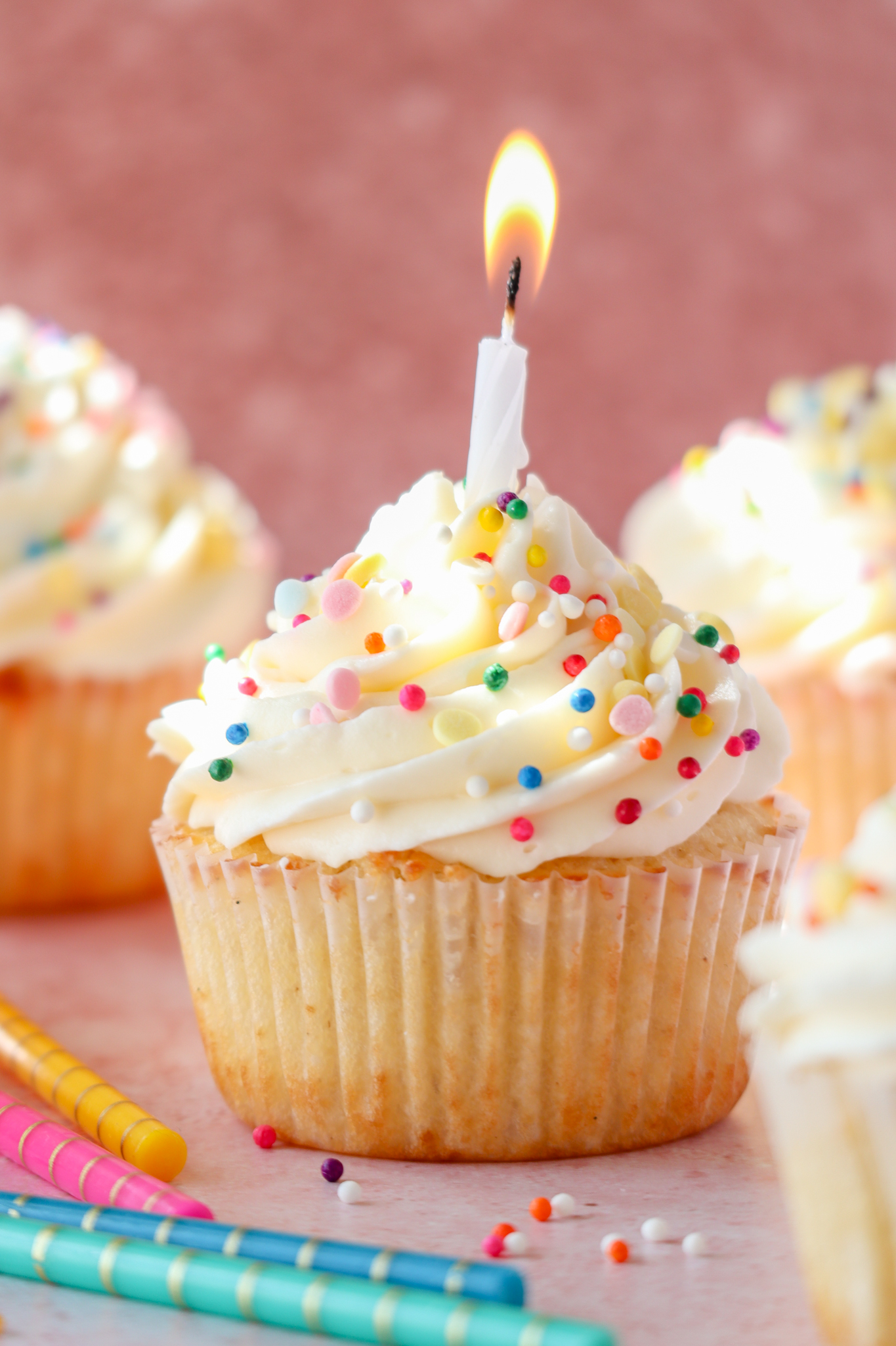 small batch vanilla cupcakes with whipped cream cheese frosting and sprinkles